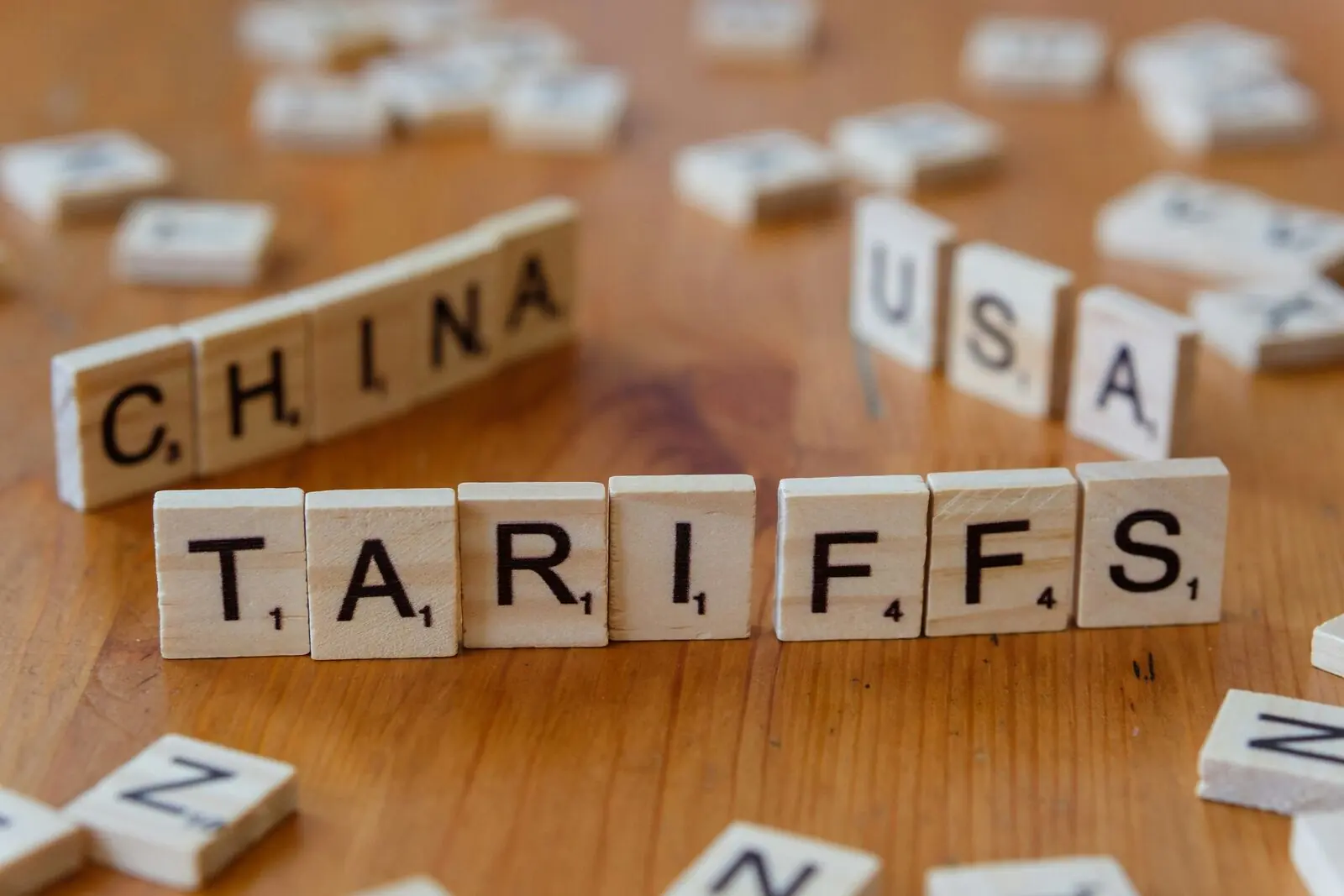 Letter tiles spelling tariffs, China and USA