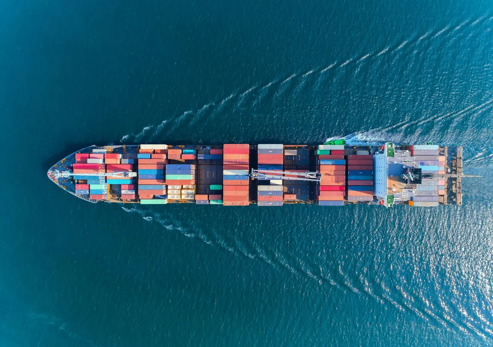 Aerial view of a loaded container ship at sea